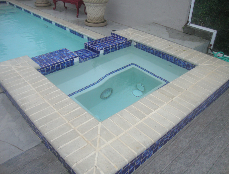 Before-Spa and pool remodel - travertine, tile and pebble finish